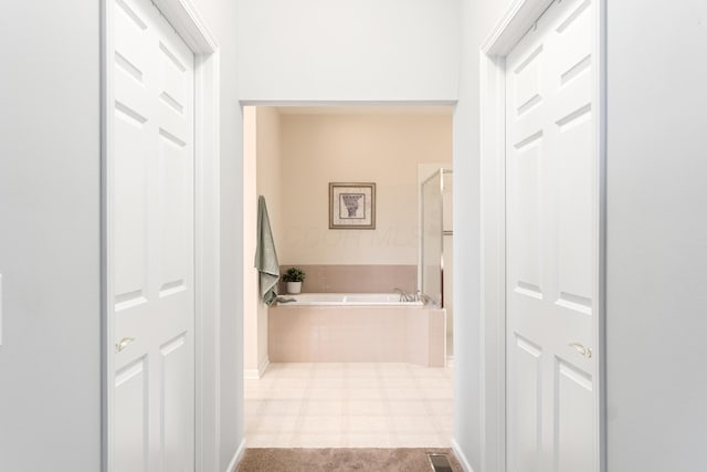 hallway featuring visible vents