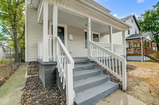 doorway to property with covered porch