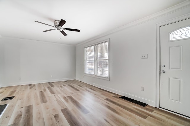 entryway featuring ceiling fan, ornamental molding, and light hardwood / wood-style floors