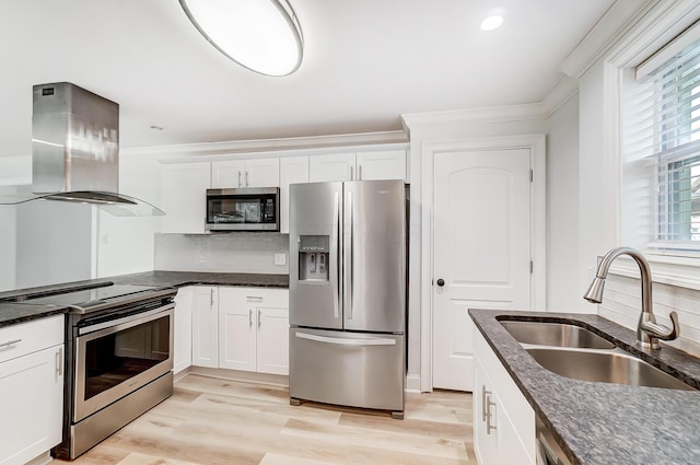 kitchen featuring island range hood, sink, stainless steel appliances, and white cabinets