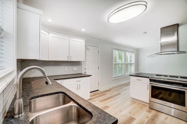 kitchen with electric stove, sink, white cabinetry, ventilation hood, and tasteful backsplash