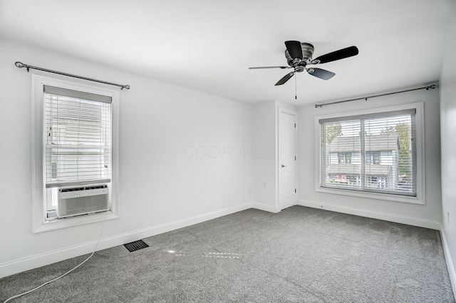 carpeted empty room with ceiling fan and cooling unit