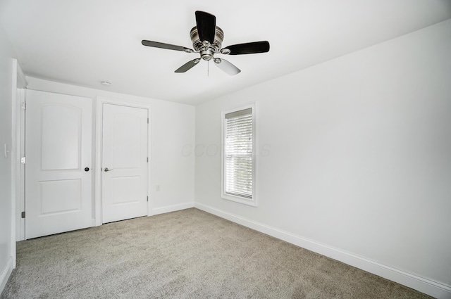 unfurnished bedroom with light carpet and ceiling fan