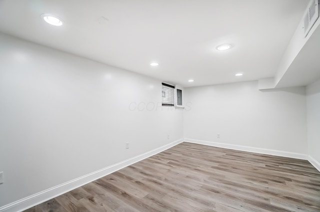 basement featuring light hardwood / wood-style floors