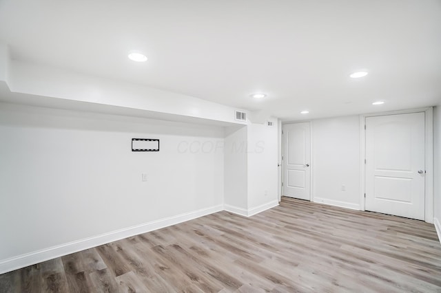 basement featuring light hardwood / wood-style floors