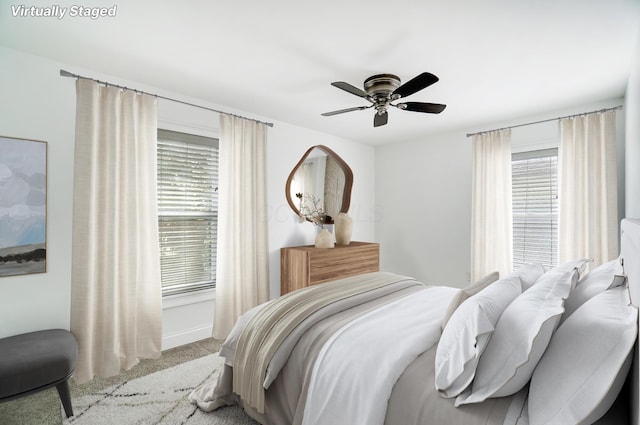 carpeted bedroom featuring ceiling fan