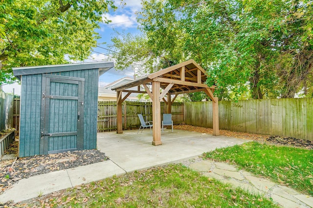 view of patio / terrace featuring a storage shed and a gazebo