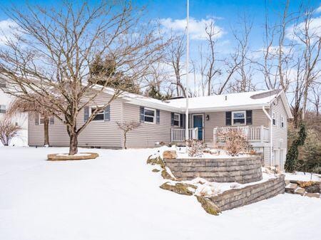 ranch-style home featuring covered porch