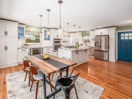 dining room featuring beverage cooler, light wood-style flooring, and recessed lighting