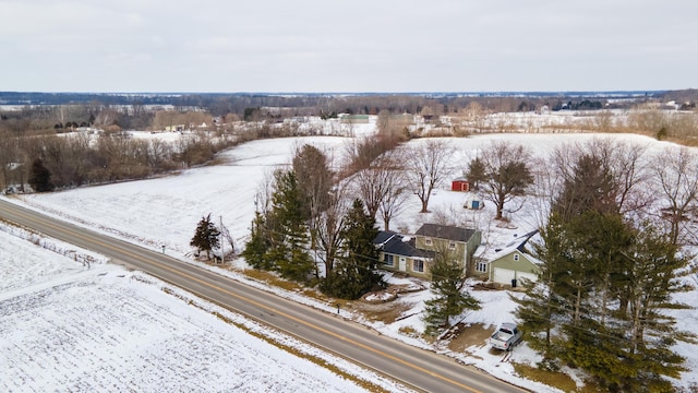 snowy aerial view featuring a rural view