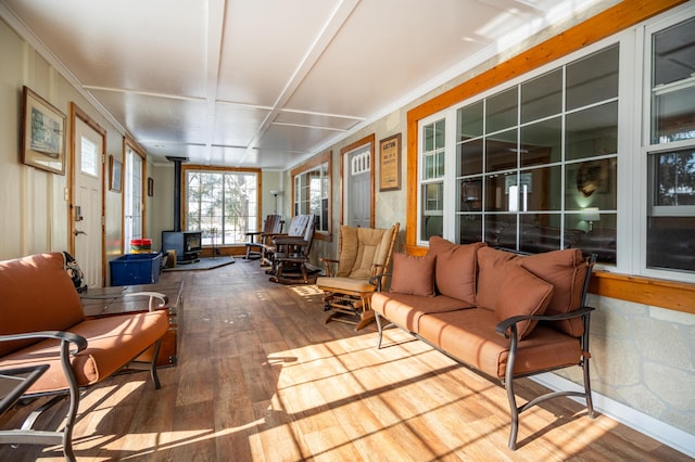 sunroom with a wood stove