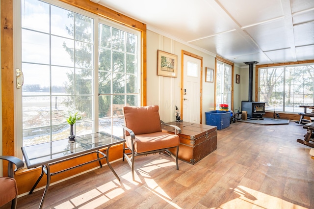 sunroom / solarium featuring a wood stove