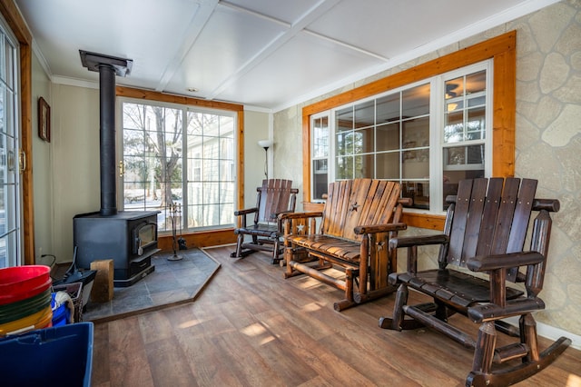 sunroom / solarium with a wood stove