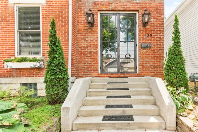 view of exterior entry featuring french doors