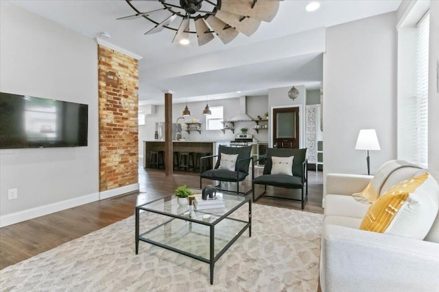 living room featuring hardwood / wood-style floors and ceiling fan