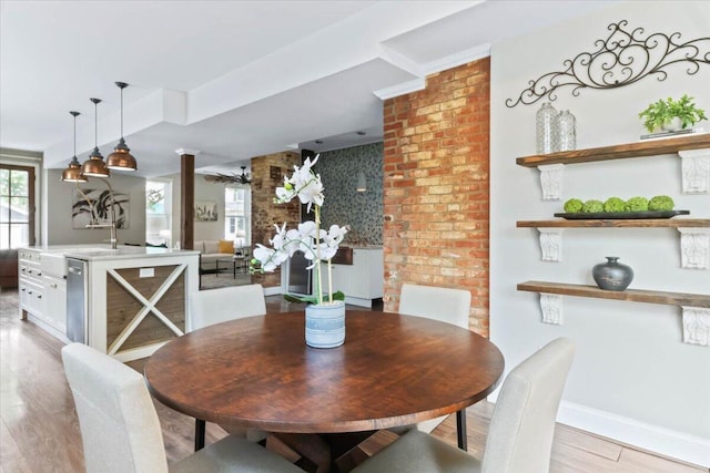 dining space featuring light wood-type flooring