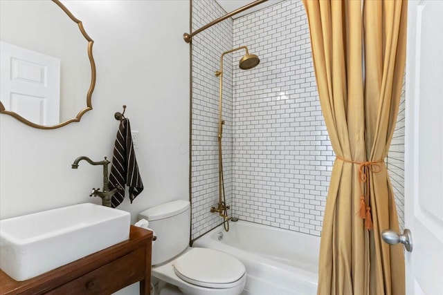 full bathroom with sink, shower / tub combo, and toilet