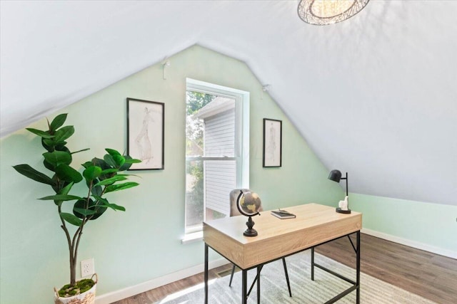 office featuring hardwood / wood-style flooring and vaulted ceiling