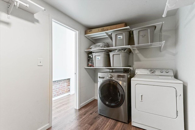 washroom featuring independent washer and dryer and dark hardwood / wood-style floors