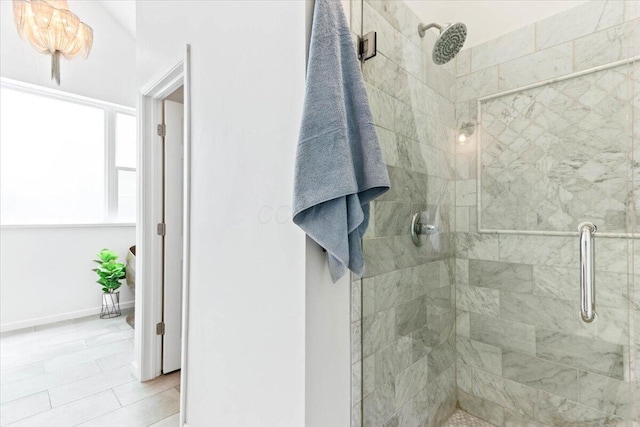 bathroom featuring an enclosed shower