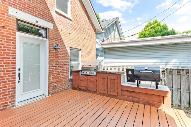 deck with grilling area and exterior kitchen