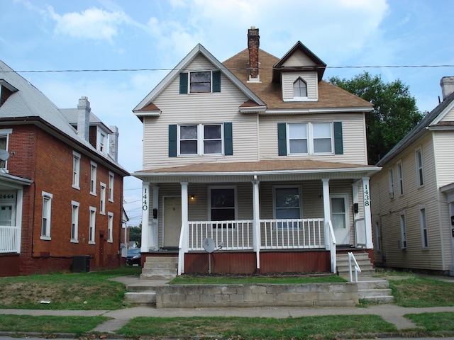 view of front of home featuring central AC and a porch