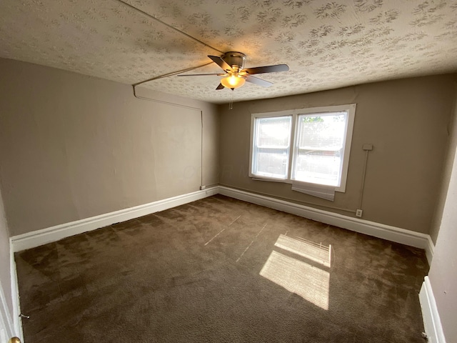 carpeted spare room with ceiling fan and a textured ceiling