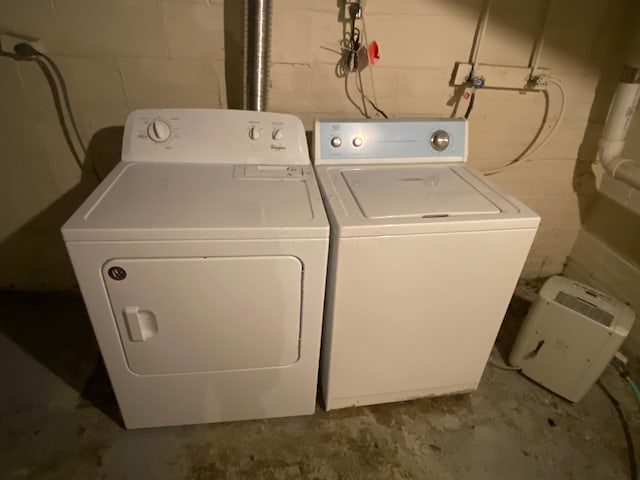 washroom with washing machine and clothes dryer