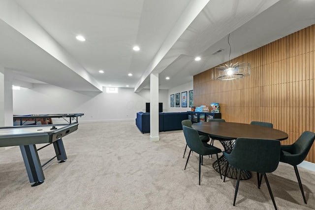 recreation room featuring recessed lighting, light colored carpet, visible vents, wood walls, and baseboards