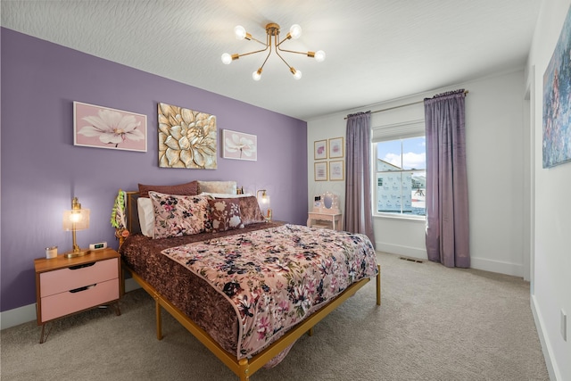 bedroom with light colored carpet, visible vents, a textured ceiling, a chandelier, and baseboards