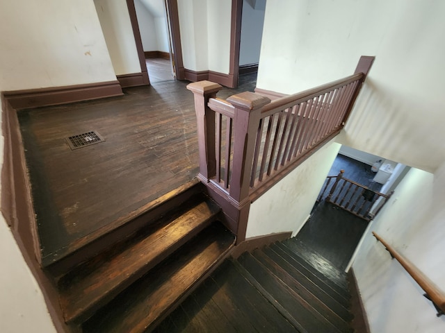 stairway featuring hardwood / wood-style flooring