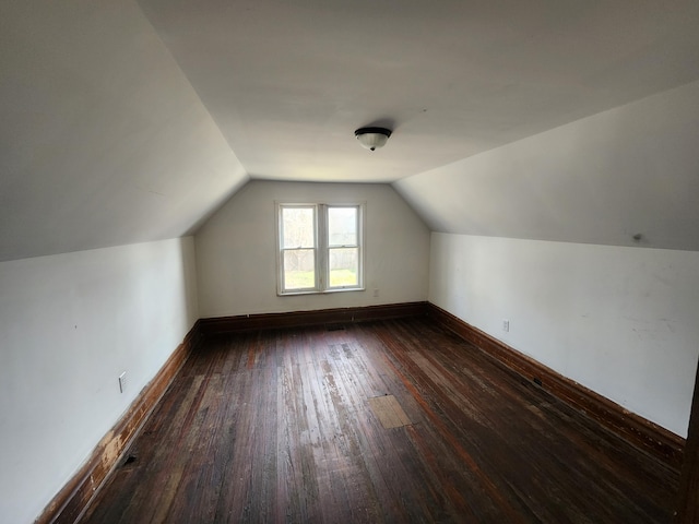 bonus room featuring dark hardwood / wood-style flooring and lofted ceiling