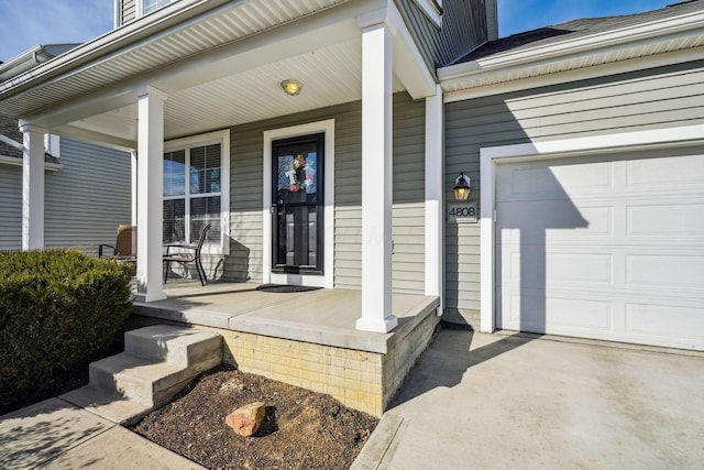 property entrance with a garage and a porch