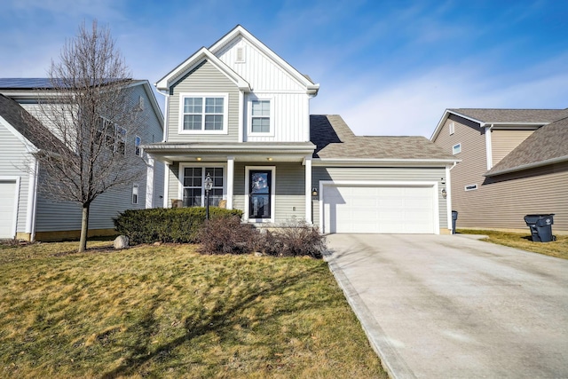 view of front of home with a front lawn and a garage