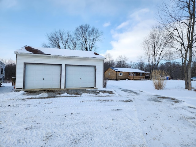 view of snow covered garage