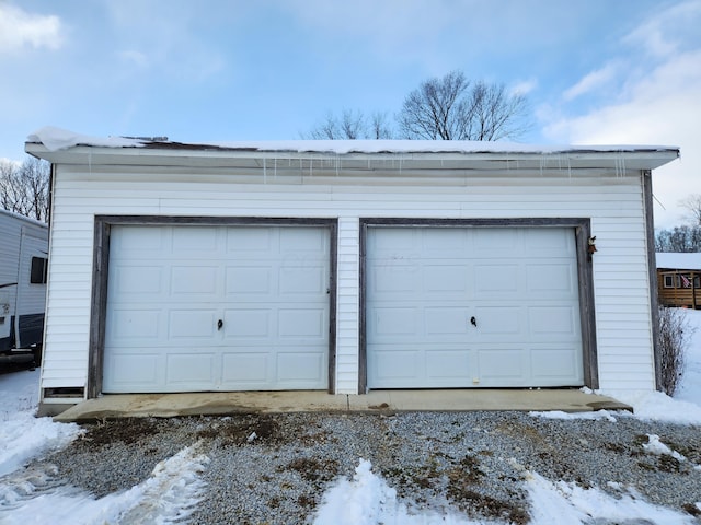 view of snow covered garage