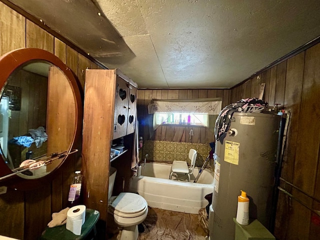 full bath featuring a textured ceiling, wood walls, gas water heater, and toilet