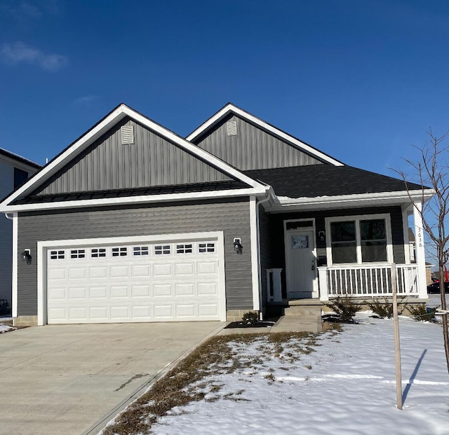 view of front of home with a garage and covered porch