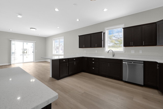 kitchen with recessed lighting, light wood-style floors, a sink, dishwasher, and a peninsula