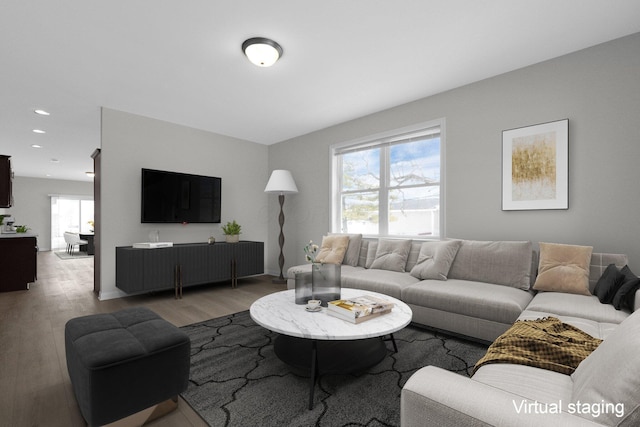 living area with recessed lighting and light wood-style flooring