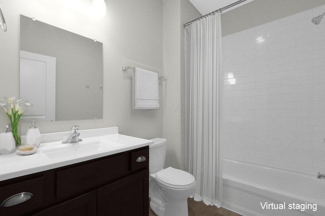 full bath featuring shower / bath combo with shower curtain, vanity, and toilet