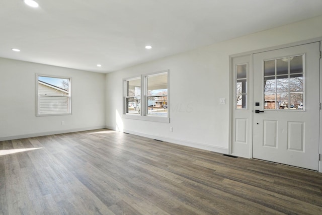 entrance foyer with baseboards, dark wood finished floors, and recessed lighting