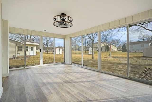 unfurnished sunroom featuring a residential view