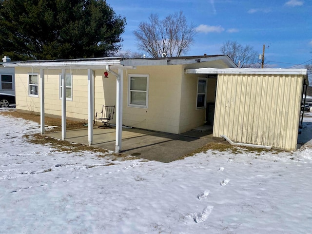 view of snow covered house