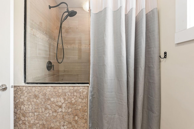 bathroom featuring curtained shower