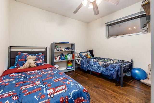 bedroom featuring ceiling fan and dark wood-type flooring