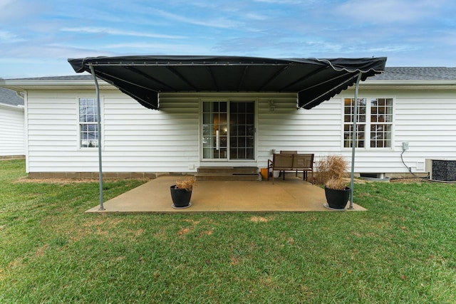 back of property featuring a patio, cooling unit, and a yard