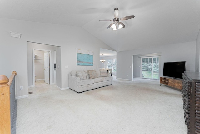 living room with ceiling fan with notable chandelier, vaulted ceiling, and light carpet