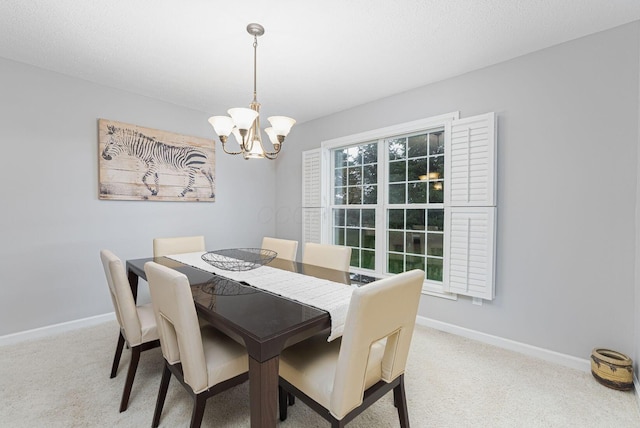 carpeted dining space with a textured ceiling and a notable chandelier