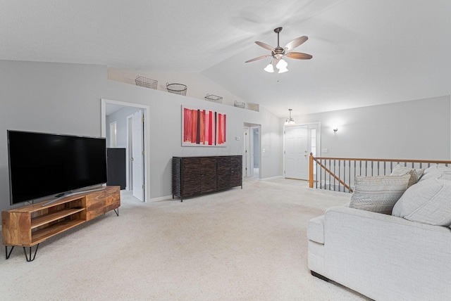 carpeted living room with vaulted ceiling and ceiling fan